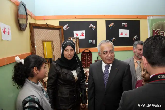 Palestinian Prime Minister Salam Fayyad participates in a celebration at "the happiness of Childhood Center" on the occasion of Mother Day in the West Bank city of Ramallah on March 21, 2011. Photo by Issam Rimawi