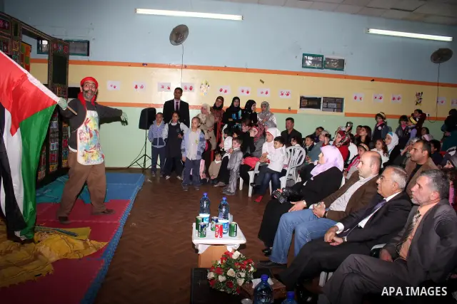 Palestinian Prime Minister Salam Fayyad participates in a celebration at "the happiness of Childhood Center" on the occasion of Mother Day in the West Bank city of Ramallah on March 21, 2011. Photo by Issam Rimawi
