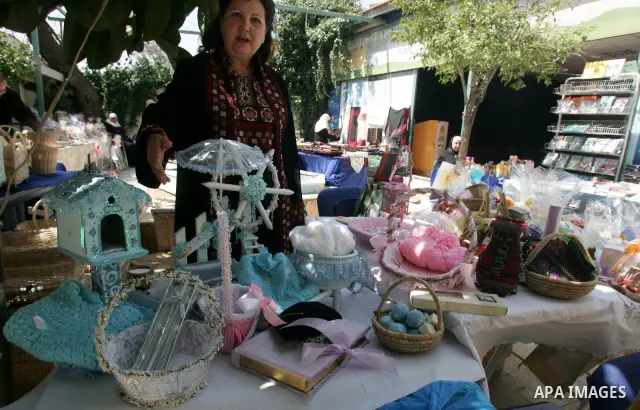Palestinian women show their home made tradition works during an exhibition in the ocassion of the Mother Day at Jerusalem youth club, in Jerusalem on March 21, 2011. Photo by Mahfouz Abu Turk