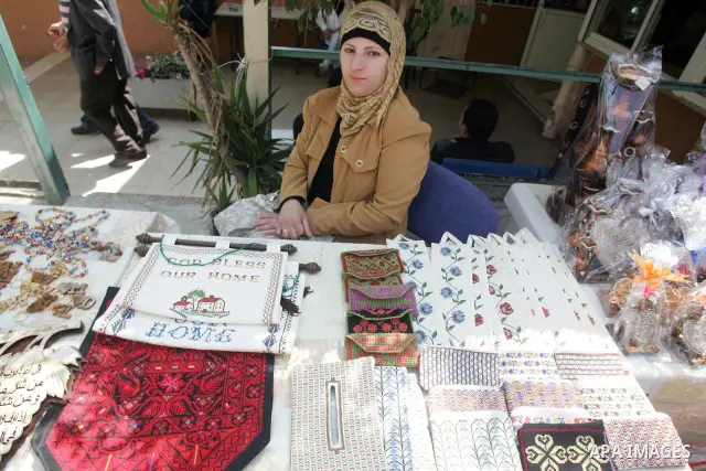 Palestinian women show their home made tradition works during an exhibition in the ocassion of the Mother Day at Jerusalem youth club, in Jerusalem on March 21, 2011. Photo by Mahfouz Abu Turk
