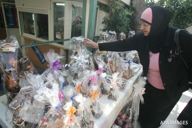 Palestinian women show their home made tradition works during an exhibition in the ocassion of the Mother Day at Jerusalem youth club, in Jerusalem on March 21, 2011. Photo by Mahfouz Abu Turk