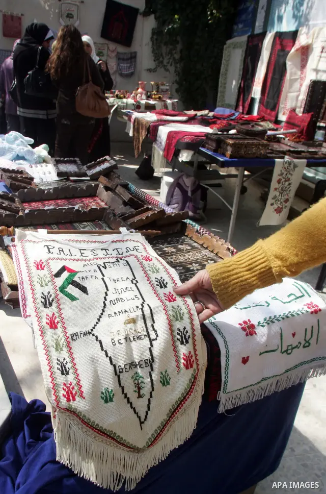 Palestinian women show their home made tradition works during an exhibition in the ocassion of the Mother Day at Jerusalem youth club, in Jerusalem on March 21, 2011. Photo by Mahfouz Abu Turk