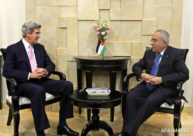 Palestinian Prime Minister Salam Fayyad meets with U.S. Senator John Kerry in the West Bank city of Ramallah March 22, 2011. Photo by Mustafa Abu Dayeh