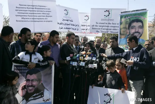Co-workers and family members of palestinian kidnapped engineer Derar Abu Sissi hold his photos during protest calling for his release in Gaza March 22,2011. Derar Abu sissi was kidnapped by the mossad men in Ukrania on...
