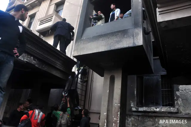 Egyptian firefighters operate on one of the building of the Interior Ministry after a fire erupted, in Cairo, Egypt, 22 March 2011. Egypt's Interior Ministry building was set ablaze by disgruntled police officers on 22 M...
