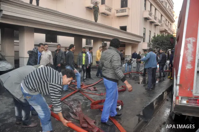 Egyptian firefighters operate on one of the building of the Interior Ministry after a fire erupted, in Cairo, Egypt, 22 March 2011. Egypt's Interior Ministry building was set ablaze by disgruntled police officers on 22 M...