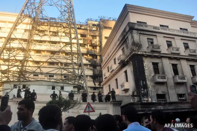 Egyptian firefighters operate on one of the building of the Interior Ministry after a fire erupted, in Cairo, Egypt, 22 March 2011. Egypt's Interior Ministry building was set ablaze by disgruntled police officers on 22 M...