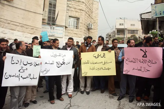 Palestinian teachers take part in a demonstration outside the office of the Directorate of Education in the West Bank city of Hebron on March 23 ,2011. Photo by Najeh Hashlamoun.