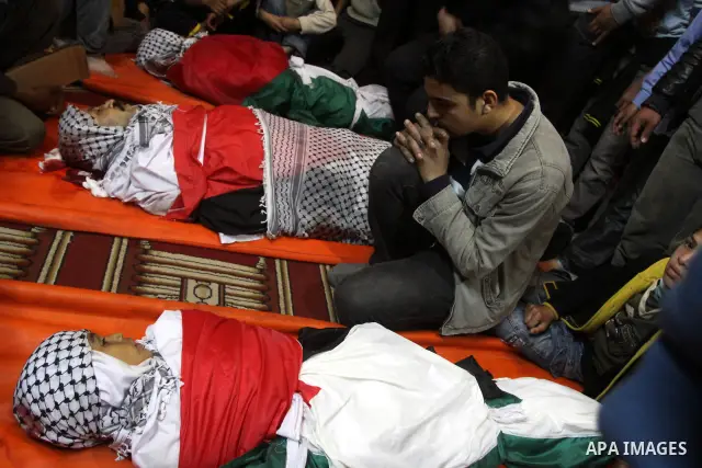 Palestinian mourners attend a funeral at a mosque in Gaza City on March 23, 2011 a day after eight Gazans were killed, among them two minors and four militants, as tensions soared on the border with Israel after days of...
