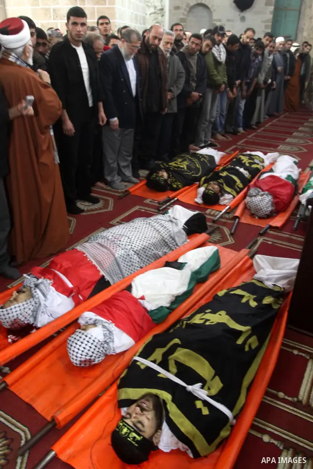 Palestinian mourners attend a funeral at a mosque in Gaza City on March 23, 2011 a day after eight Gazans were killed, among them two minors and four militants, as tensions soared on the border with Israel after days of...