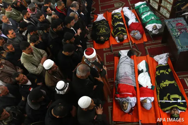 Palestinian mourners attend a funeral at a mosque in Gaza City on March 23, 2011 a day after eight Gazans were killed, among them two minors and four militants, as tensions soared on the border with Israel after days of...