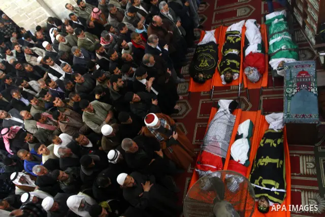 Palestinian mourners attend a funeral at a mosque in Gaza City on March 23, 2011 a day after eight Gazans were killed, among them two minors and four militants, as tensions soared on the border with Israel after days of...
