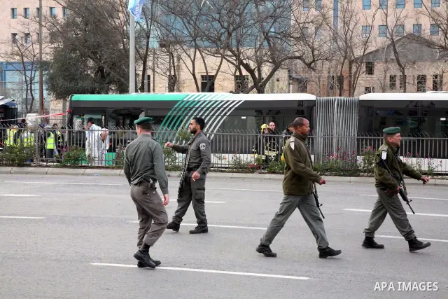 Israeli police patrol at the scene of a bomb attack at a bus station in Jerusalem blowing up next to the bus and near a kiosk, called the 'Explosive Kiosk', on 23 March 2011. Over 30 people were injured by a parcel bomb...