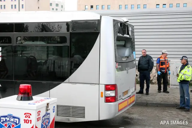 Israeli police patrol at the scene of a bomb attack at a bus station in Jerusalem blowing up next to the bus and near a kiosk, called the 'Explosive Kiosk', on 23 March 2011. Over 30 people were injured by a parcel bomb...