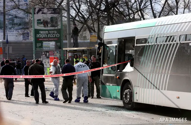 Israeli police patrol at the scene of a bomb attack at a bus station in Jerusalem blowing up next to the bus and near a kiosk, called the 'Explosive Kiosk', on 23 March 2011. Over 30 people were injured by a parcel bomb...
