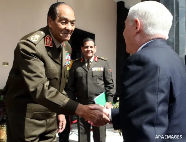 The Chairman of the Egyptian Supreme Council of Armed Forces, Mohammed Hussein Tantawi (L) welcomes US Defense Secretary Robert Gates (R) upon his arrival for their meeting at the Defense Ministry, in Cairo, on March 24,...
