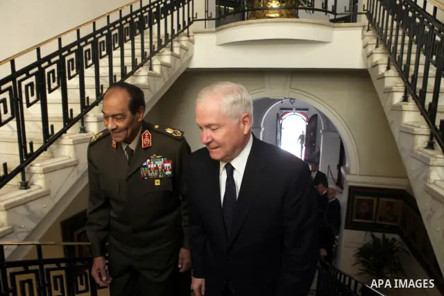 US Defense Secretary Robert Gates (R) and the Chairman of the Egyptian Supreme Council of Armed Forces, Mohammed Hussein Tantawi (L) arrive for their meeting at the Defense Ministry, in Cairo, on March 24, 2011. Photo by...