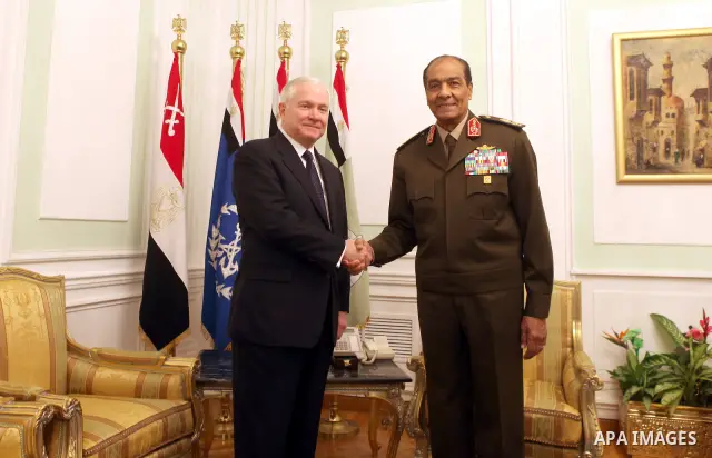The Chairman of the Egyptian Supreme Council of Armed Forces, Mohammed Hussein Tantawi (R) and US Defense Secretary Robert Gates pose for a photograph at the start of their meeting at the Defense Ministry, in Cairo, on M...