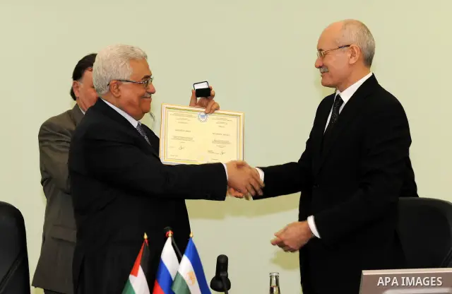 Palestinian President Mahmoud Abbas is given an honorary doctorate degree from University of Ufa in Bashkiria on March 24,2011. Photo by Thaer Ganaim