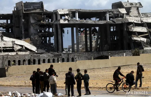 Palestinians observe the destroyed security office in Gaza City, on March 25, 2011, as Israeli aircraft attacked four targets in the Gaza Strip during the night, lightly wounding three people, in response to Palestinian...