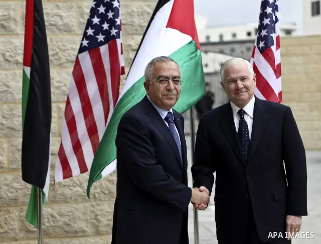 U.S Defense Secretary Robert Gates meets with Palestinian Prime Minister Salam Fayyad in the West Bank city of Ramallah March 25, 2011. Gates urged Israeli and Palestinian leaders on Thursday to advance stalled peace eff...