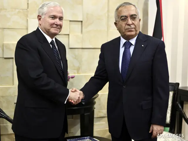 U.S Defense Secretary Robert Gates meets with Palestinian Prime Minister Salam Fayyad in the West Bank city of Ramallah March 25, 2011. Gates urged Israeli and Palestinian leaders on Thursday to advance stalled peace eff...