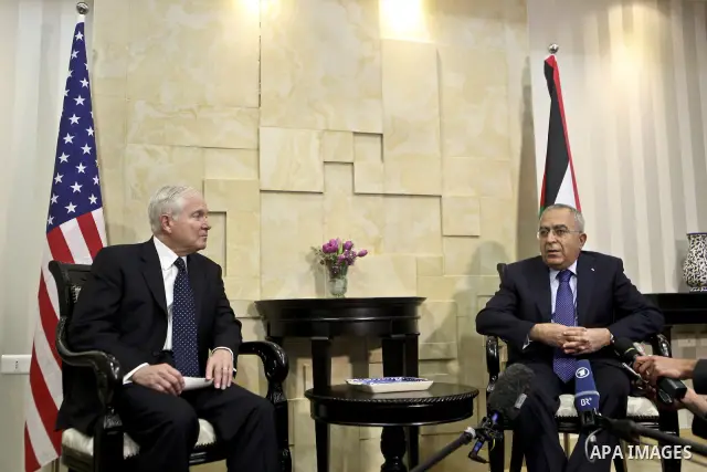 U.S Defense Secretary Robert Gates meets with Palestinian Prime Minister Salam Fayyad in the West Bank city of Ramallah March 25, 2011. Gates urged Israeli and Palestinian leaders on Thursday to advance stalled peace eff...
