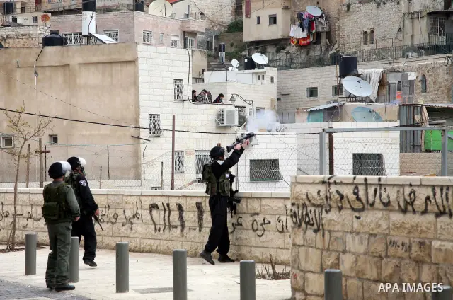 Israeli Border Police fire tear gas towards Palestinian stone throwers during clashes in the mostly Arab neighborhood of Silwan in East Jerusalem March 25, 2011. Photo by Sliman Khader..
