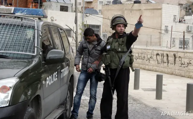 Israeli Border Police detain a Palestinian youth during clashes in the mostly Arab neighborhood of Silwan in East Jerusalem March 25, 2011. Photo by Mahfouz Abu Turk