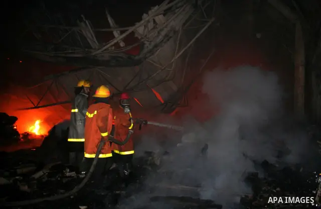 Palestinian firemen fighting the fire broke out in a soft drinks factory in Gaza after huge explosion hit the place in zeiton neighborhood Gaza city. March 25 2011. Despite Israel military said none of its forces were op...
