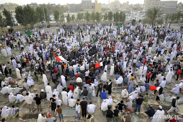 Pro-reforms protesters march during the funeral of 71-year-old Isa Mohammed in Maamer village south east of the capital Manama, Bahrain, 26 March 2011. According to local media reports, Mohammed died on 25 March after te...