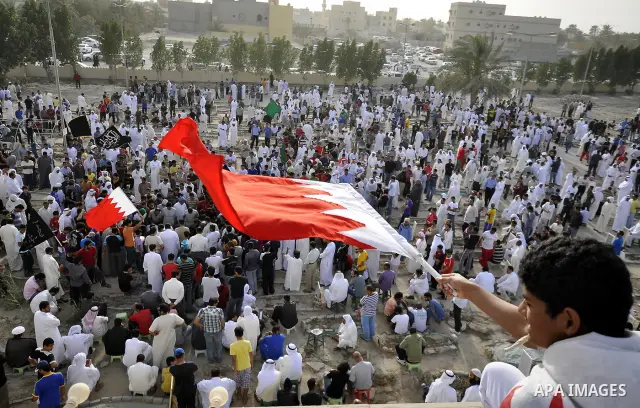 Pro-reforms protesters march during the funeral of 71-year-old Isa Mohammed in Maamer village south east of the capital Manama, Bahrain, 26 March 2011. According to local media reports, Mohammed died on 25 March after te...