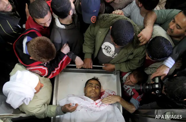 Relatives of Palestinian militants look at there bodies in the morgue of Kamal Edwan hospital in Beit Lahya northern Gaza strip. March 27, 2011. Photo by Ali Jadallh