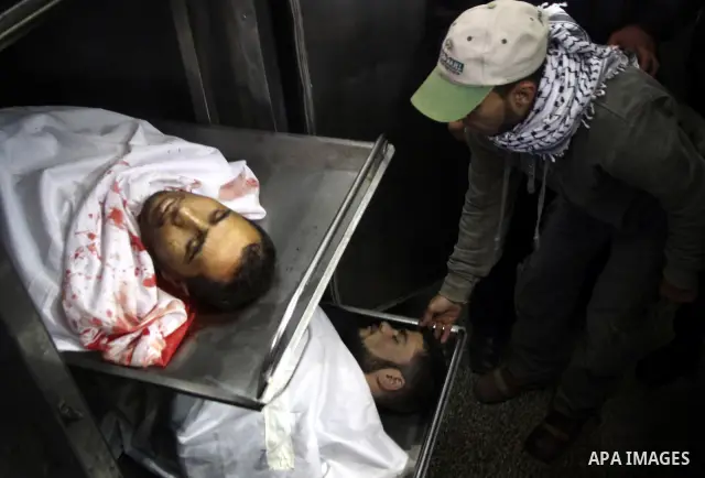 Relatives of Palestinian militants look at thier bodies in the morgue of Kamal Edwan hospital in Beit Lahya northern Gaza strip. March 27, 2011. Photo by Ali Jadallh