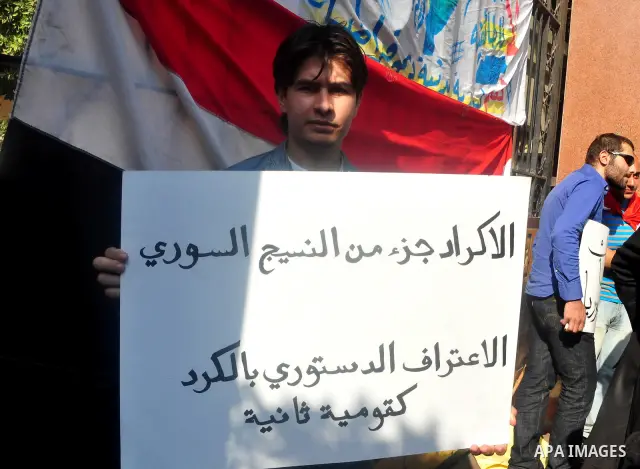 Syrians living in Egypt demonstrate against the recent actions of the Syrian government and in support of protesters, outside the Arab League headquarters in Cairo, Egypt Sunday, March 27, 2011. Syrian army units deploye...