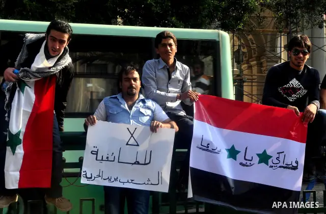 Syrians living in Egypt demonstrate against the recent actions of the Syrian government and in support of protesters, outside the Arab League headquarters in Cairo, Egypt Sunday, March 27, 2011. Syrian army units deploye...