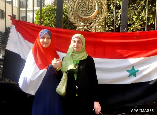Syrians living in Egypt demonstrate against the recent actions of the Syrian government and in support of protesters, outside the Arab League headquarters in Cairo, Egypt Sunday, March 27, 2011. Syrian army units deploye...