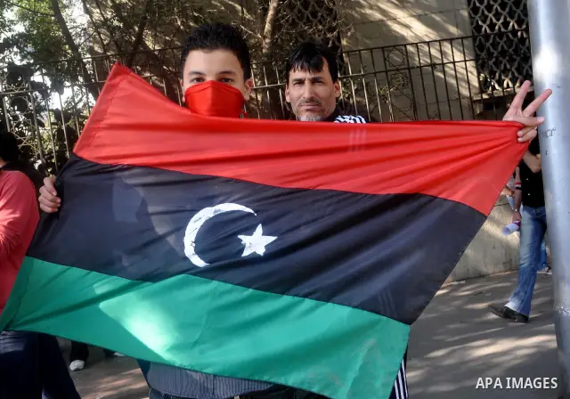 Libyans living in Egypt demonstrate against the Libyan leader Muammar Gaddafi forces and in support of rebels, outside the Arab League headquarters in Cairo, Egypt Sunday, March 27, 2011. Forces loyal to Libyan leader Mu...