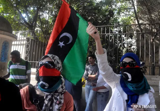Libyans living in Egypt demonstrate against the Libyan leader Muammar Gaddafi forces and in support of rebels, outside the Arab League headquarters in Cairo, Egypt Sunday, March 27, 2011. Forces loyal to Libyan leader Mu...