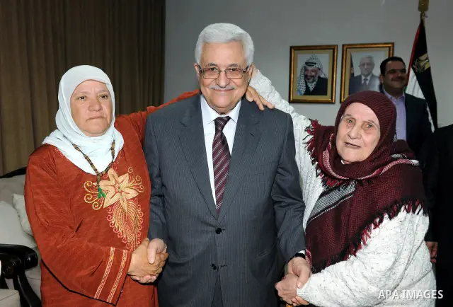 Palestinian President Mahmoud Abbas (Abu Mazen) meets with the Mothers Zakyia Zaid and Farsakha Al deik in west bank city of Ramallah March,28,2011 Photo by Thaer Ganaim