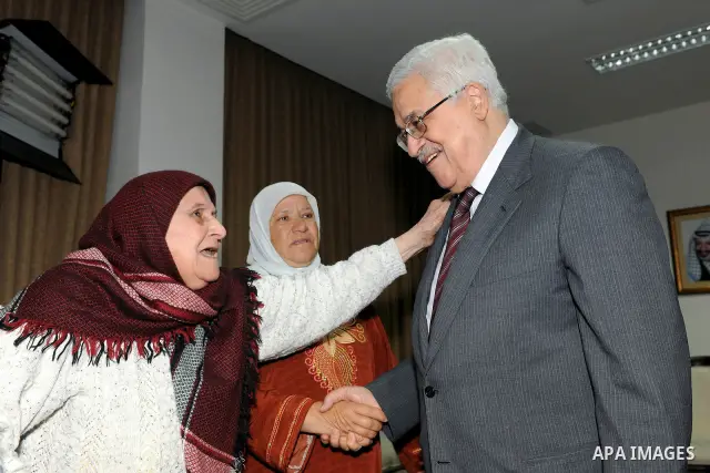 Palestinian President Mahmoud Abbas (Abu Mazen) meets with the Mothers Zakyia Zaid and Farsakha Al deik in west bank city of Ramallah March,28,2011 Photo by Thaer Ganaim