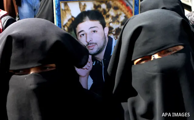 Palestinians women hold pictures of their prisoned relatives in Israeli jails as they gather in a weekly activity calling for their liberty at the Red Cross headquarters in Gaza City on Marsh 28, 2011. About 7000 prisone...