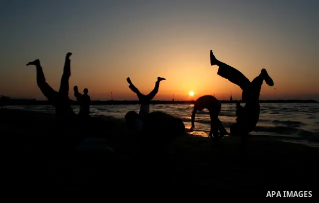 Palestinian youths practice jumping on the beach in Gaza City, on March 28, 2011 as they enjoy their free time. Photo by Mahmoud Nassar
