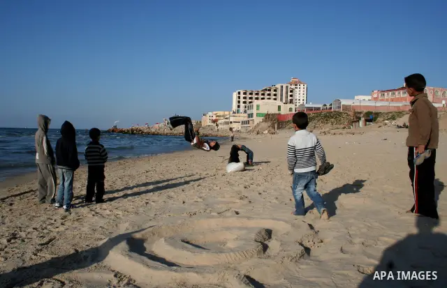 Palestinian youths practice jumping on the beach in Gaza City, on March 28, 2011 as they enjoy their free time. Photo by Mahmoud Nassar