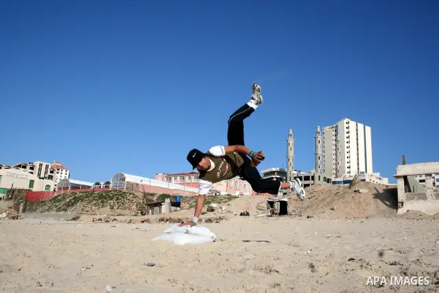 Palestinian youths practice jumping on the beach in Gaza City, on March 28, 2011 as they enjoy their free time. Photo by Mahmoud Nassar