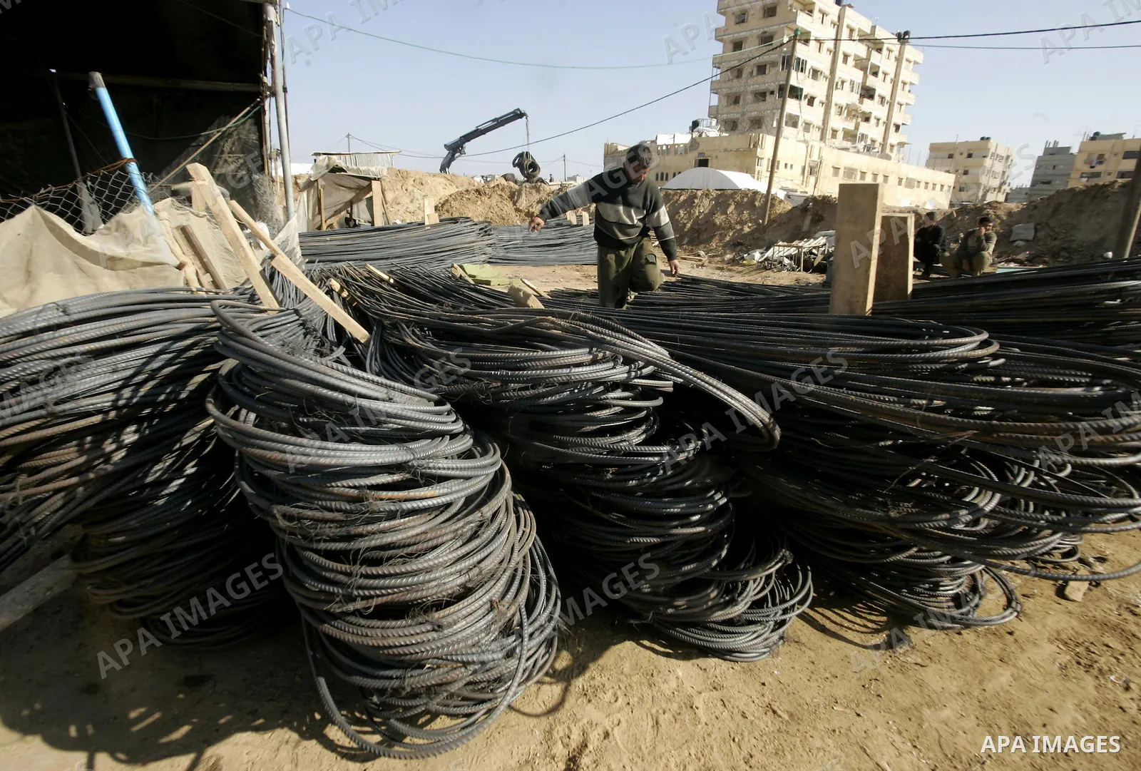 Palestinian man assembles iron coming from a tunnel used for smuggling goods into the Gaza Strip, which links Egypt to the southern Gaza town of Rafah, on March 29, 2011. Underground tunnels located on the frontier betwe...