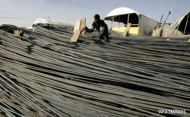 Palestinian man assembles iron coming from a tunnel used for smuggling goods into the Gaza Strip, which links Egypt to the southern Gaza town of Rafah, on March 29, 2011. Underground tunnels located on the frontier betwe...