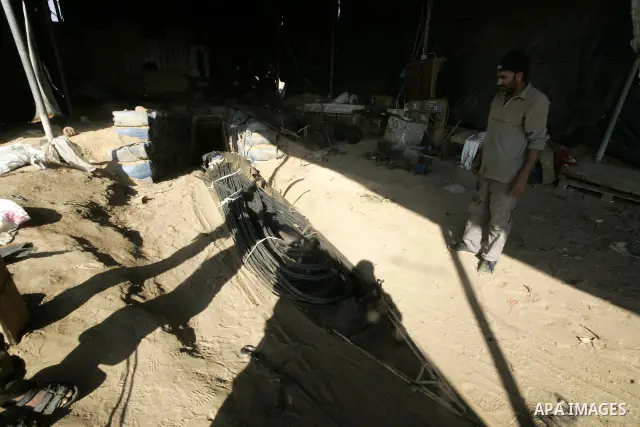 Palestinian man assembles iron coming from a tunnel used for smuggling goods into the Gaza Strip, which links Egypt to the southern Gaza town of Rafah, on March 29, 2011. Underground tunnels located on the frontier betwe...