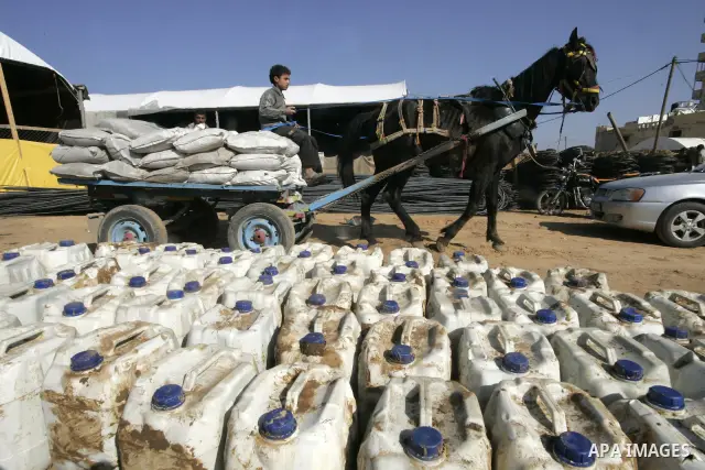 Palestinian man assembles cement coming from a tunnel used for smuggling goods into the Gaza Strip, which links Egypt to the southern Gaza town of Rafah, on March 29, 2011. Underground tunnels located on the frontier bet...