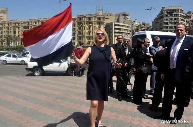 Tourists take memorial photos on March 29,2011 at the downtown Cairo's Tahrir square, the giant traffic-clogged roundabout, which hundreds of thousands of Egyptians turned into the focus of their uprising to bring down H...